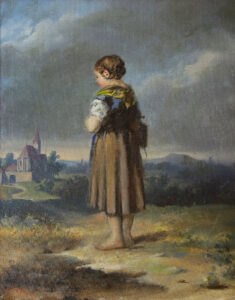 Schulmädchen in Tracht auf dem Weg zur Dorfkirche.