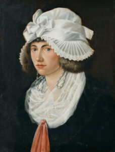 Junge Frau mit Ohrgehänge und Spitzenhaube – Sitzender junger Mann.