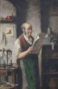 Schuhmacher in seiner Werkstatt studiert die Zeitung.